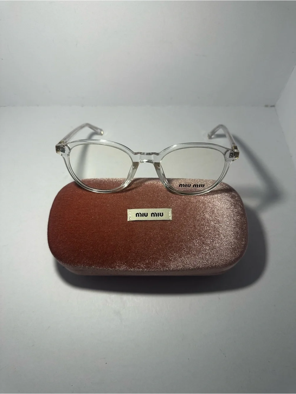Miu Miu Clear Round Eyeglasses with Pink Velvet Case